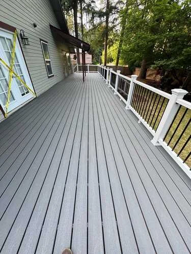 DNH deck with light railing beside a home